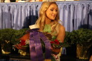 Miss Kentucky 2026 Reagan Earlywine parades around with the championship ham as bids flow in at the annual Kentucky Farm Bureau's charity ham auction.