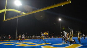 Lincoln Prep players celebrate a touchdown Friday night against St. Joseph Benton. Despite football being on the list of high-risk activities by the National High School Federation, schools in Missouri were able to take the field or courts this past weekend under varying amounts of safety measures.
