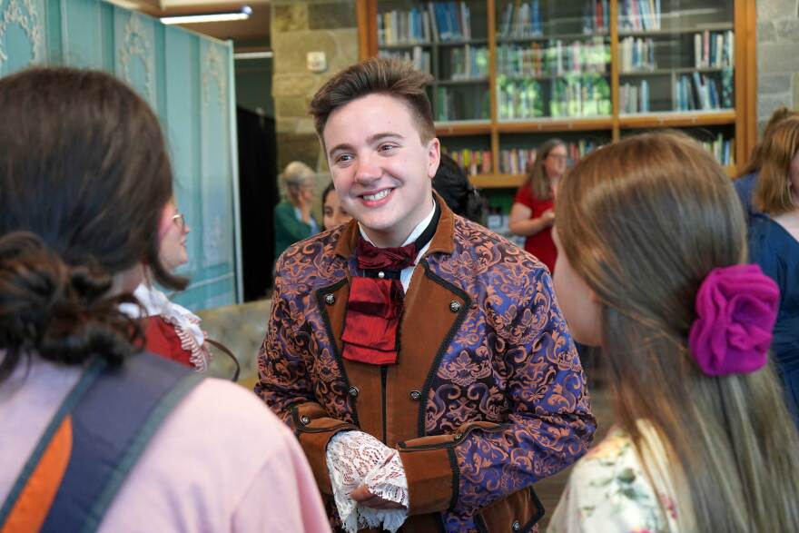 Jackson Hooper performs during an immersive theatrical murder mystery at the Soldotna Public Library in Soldotna, Alaska, on Wednesday, July 29, 2026.
