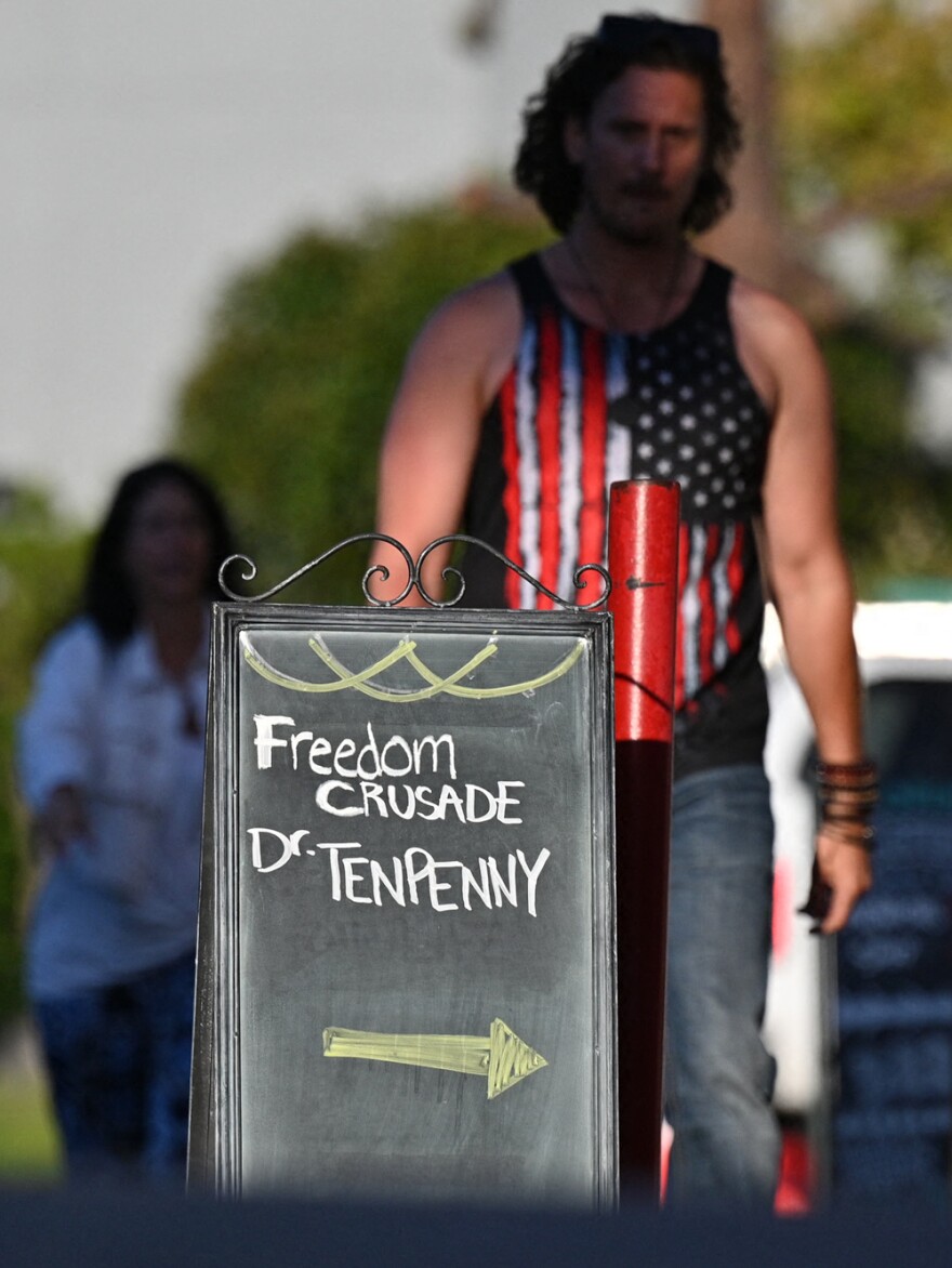 People arrive at Old World Huntington Beach where Dr. Sherri Tenpenny was scheduled to speak at the "Freedom Crusade Presents Dr. Sherri Tenpenny," August 5, 2021, in Huntington Beach, California. Tenpenny is an anti-vaccination activist who supports the disproven hypothesis that vaccines cause autism and Covid-19 is a manufactured crisis.