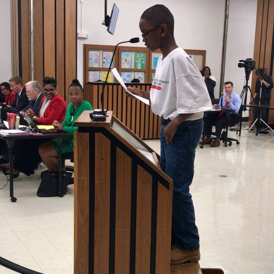A child stands on a box as he testifies in support of the Ignite Achievement Academy during a meeting of the Indianapolis Public Schools Board on Thursday, March 16, 2017.