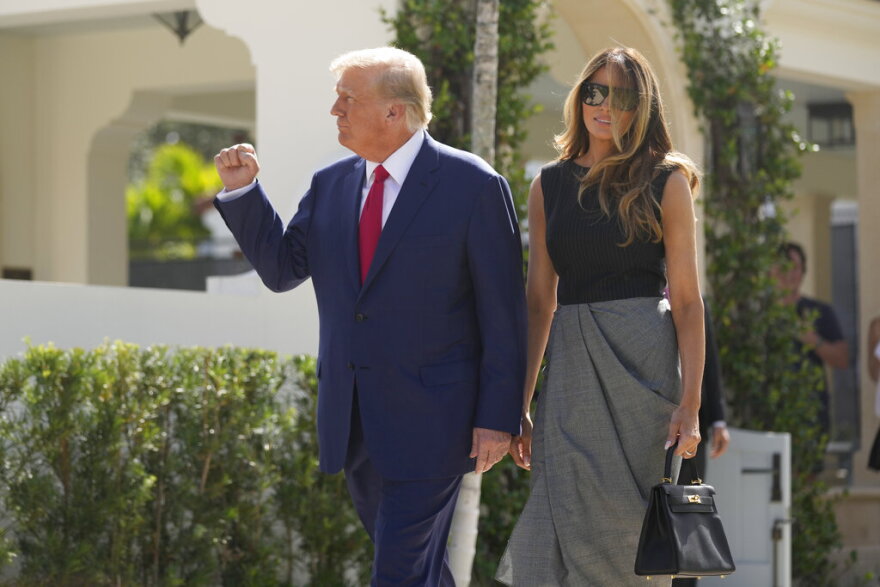 Former President Donald Trump walks out with his wife, Melania Trump, after voting at Morton and Barbara Mandel Recreation Center on Election Day, Tuesday, Nov. 8, 2022, in Palm Beach.