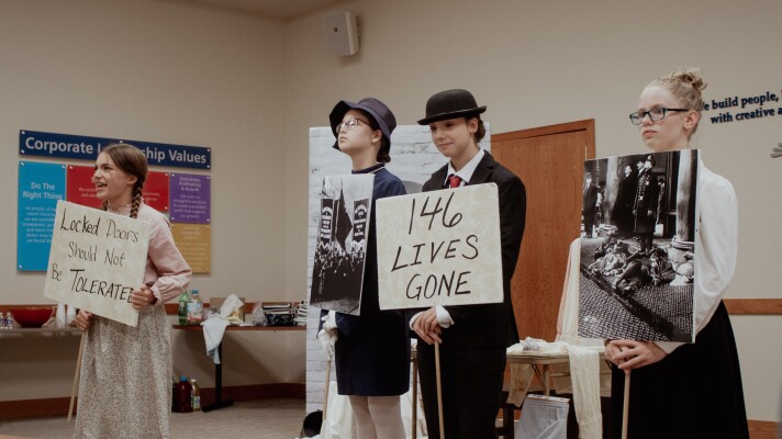 Romina Dracos, from left, Eliza Smith, C.C. Saldana and Grace Scott perform their project titled "The Triangle Shirtwaist Factory Fire: The Story of the Injustice Flames" for family and friends on Monday, June 8 before they head to National History Day competitions from June 14-18. The team of seventh graders from Lake Air Montessori are one of two Waco-area teams represented in the competition.