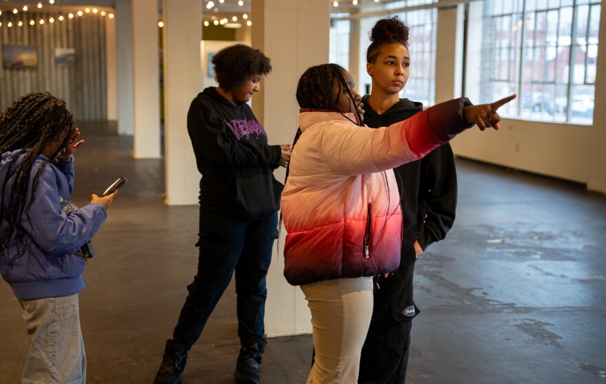 From left to right, Makhai, Genesis, Storm and Bee Puthoff check out the space where their photos will be featured at 78th Street Studios in Cleveland's Gordon Square neighborhood.