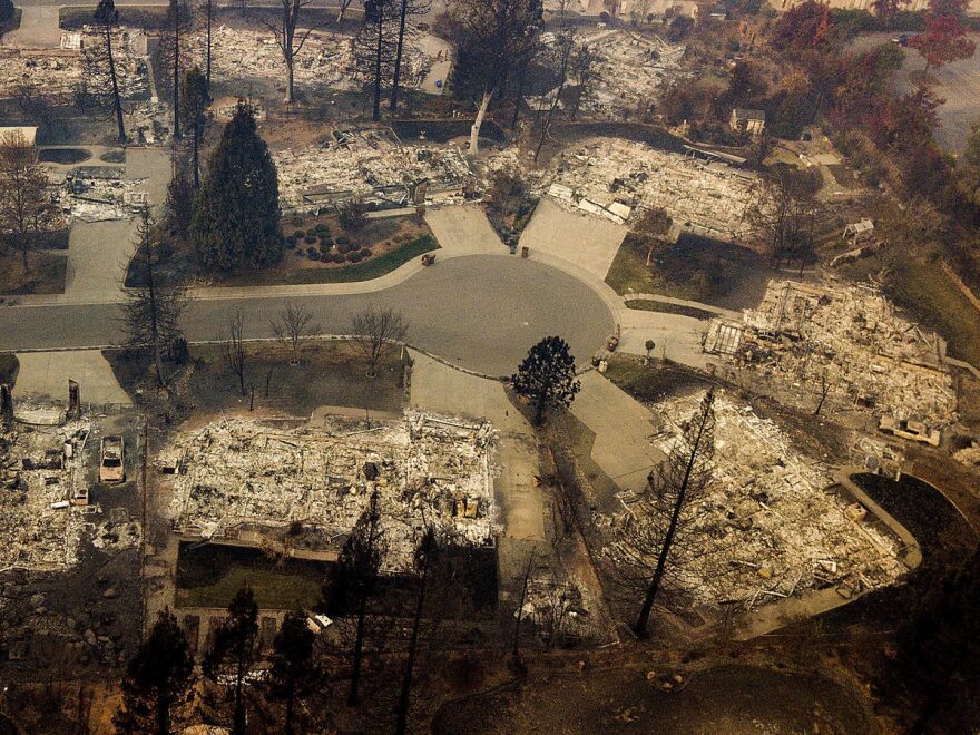 Residences leveled by the Camp Fire line a cul-de-sac in Paradise, Calif., earlier this month. A massive federal report says climate change is contributing to larger wildfires as well as other deadly extreme weather.