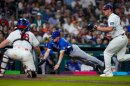 Italy shortstop Sam Antonacci (10) scores on a wild pitch by United States pitcher Brad Keller (40) in the sixth inning of a World Baseball Classic game, Tuesday, March 10, 2026, in Houston.