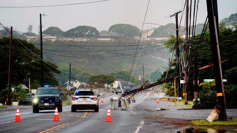 Downed power lines caused by Hurricane Lowell are seen across a road Tuesday, Sept. 8, 2026, in Hanapēpē, Kauaʻi, Hawaiʻi.