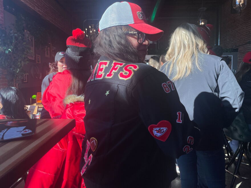 Diana Reyes, at Afterword Tavern and Shelves, in a custom jacket made by her crafty husband, who she will meet up with tonight for Valentine's Day dinner.