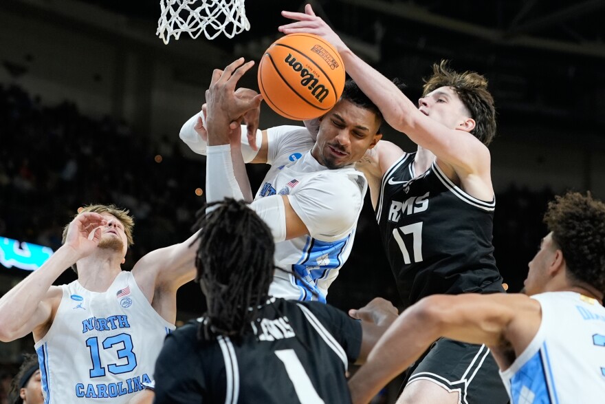 North Carolina forward Jarin Stevenson, top left, rebounds the ball during the first half in the first round of the NCAA college basketball tournament against Virginia Commonwealth, Thursday, March 19, 2026, in Greenville, S.C.