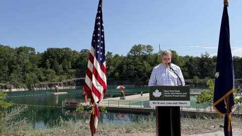 Palisades Regional Director for New York State Parks Joshua Laird stands in front of Lake Sophia at the ribbon-cutting press conference.
