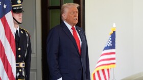 President Donald Trump waits to greet El Salvador's President Nayib Bukele at the White House, Monday, April 14, 2025, in Washington
