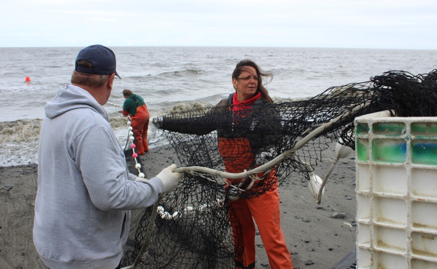 Brian Gabriel (left) and Lisa Gabriel (right) deploy a beach seine on Wednesday, July 9, 2025 in Clam Gulch.