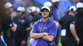 Baltimore Ravens head coach Jesse Minter watches from the sideline before an NFL preseason football game against the Washington Commanders, Friday, Aug. 28, 2026, in Baltimore. (AP Photo/Nick Wass)