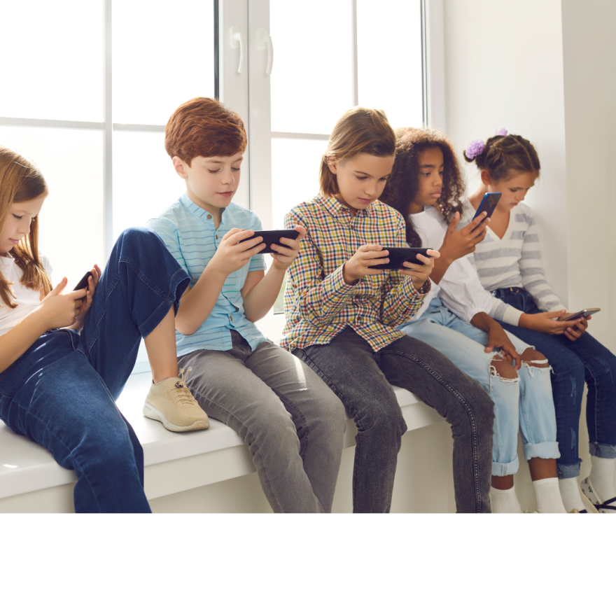 Five children play on cellphones