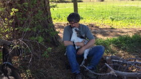 Sam Manno holding a goat.