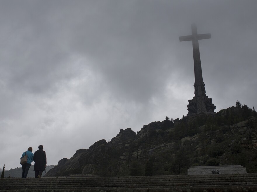 Tourists walk outside of the Spanish former dictator Gen. Francisco Franco's tomb at the Valley of the Fallen, near Madrid.