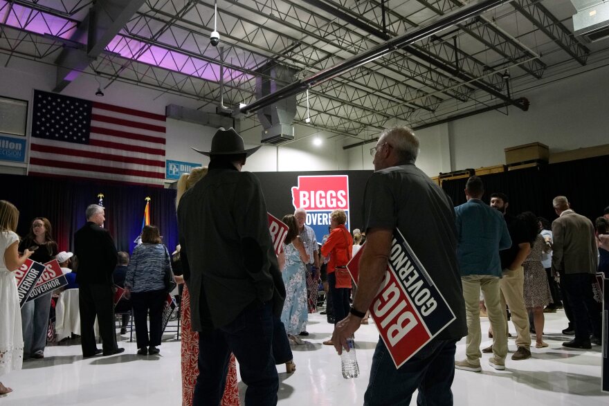 Attendees stand at a primary election night watch party for Republican gubernatorial candidate U.S. Rep. Andy Biggs on Tuesday, July 21, 2026, in Scottsdale, Ariz.