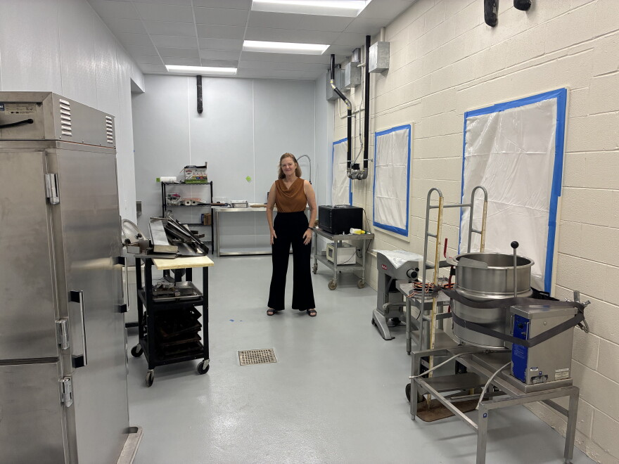Roanoke Area Ministries executive director Melissa Woodson stands in the kitchen of the new Jain Care Center in Roanoke.