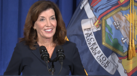 Lt. Gov. Kathy Hochul, soon-to-be Acting Gov. Hochul Credit: New York NOW “The promise I make to all New Yorkers right here, right now. I will fight like hell for you every single day, like I've always done, and always will,” Hochul said. That was the theme of her first public remarks since Gov. Andrew Cuomo announced his resignation Tuesday over multiple claims of sexual harassment that were found to be credible in a report issued by the New Attorney General’s Office last week. Cuomo has denied the claims, and said he never touched anyone inappropriately, and didn’t know his remarks to some of his staff were offensive at the time. Hochul said her administration would operate differently than her soon-to-be predecessor’s after the report identified a toxic work culture that opened the door to both sexual and verbal harassment from Cuomo and his inner circle. That will include new staff, Hochul said, after the report showed that a handful of Cuomo’s top aides were involved in trying to discredit the women who accused him of harassment. “No one who’s been named as doing anything unethical in the report will remain in my administration,” Hochul said. “At the end of my term, whenever it is, no one will ever describe my administration as a toxic work environment.” Hochul said she wasn’t aware of any of the allegations included in the attorney general’s report before they came to light in the press, and on social media. She struck a different tone than Cuomo, who’s been known by reporters in Albany as someone who’s often hostile toward members of the press when he’s asked uncomfortable questions. That didn’t happen with Hochul. When asked why she changed her position on driver’s licenses for undocumented immigrants, Hochul said she’d evolved on the issue since she opposed it as Erie County Clerk. Her position had changed by the time the Legislature approved it in 2019. “I had taken a position that has now evolved,” Hochul said. “Immigrants need that. They wouldn't be able to get to their jobs, parents need to take their kids to doctor appointments, and I'm proud to support that law.” Hochul also said her strategy as acting governor would be one of careful deliberation after consulting with residents and experts — and that she’s more than ready to step in. “I want people to know that I'm ready for this. Not something we expected or asked for, but I'm fully prepared,” Hochul said. Since she took office as the state’s second-highest ranking elected official in 2015, Hochul has tirelessly criss-crossed the state, entering communities rarely visited by the three-term governor, like the North Country. As head of the state’s Regional Economic Development Councils, she’s also been actively involved in developing regional strategies to give communities a boost where they need them. And Hochul has been to no shortage of public events in support of several issues. “I'll do what I've always done,” Hochul said. “I will travel the state to meet New Yorkers to listen to them, to assure them that I've got their backs.” But as she becomes the state’s 57th governor, and the first woman to serve in the position, Hochul will also have to confront several challenges felt by New York residents, like the ongoing spread of the Delta variant of COVID-19. Hochul’s message on the pandemic lined up with Cuomo’s position: that the best strategy to defeat the virus will be to get more individuals vaccinated. Aside from that, Hochul said she’ll use the state’s full resources, including health experts, to develop a strategy. “All options are on the table,” Hochul said. “I'll be looking very closely at the trends in consultation with our healthcare professionals as well as the CDC.” With Hochul taking office in two weeks, there’s also the lingering question of who she’ll choose as her temporary successor. Because of court precedent, Hochul will be allowed to appoint her own lieutenant governor, rather than having the position temporary filled by the majority leader of the State Senate. Former Gov. David Paterson did the same after he took office. When asked if she had anyone in mind for the job, Hochul simply gave a shrug and said she didn’t have a preference of where that person should be from for now. But she said she knew there had to be balance. “I love upstate. I love downstate,” Hochul said. “I love the whole state and there so many qualified individuals but I'm cognizant of the need for diversity and an inclusive ticket and I’m going to name someone that I believe the state will be familiar with and be very proud of.” Hochul said she expects to make that decision sometime in the next two weeks.