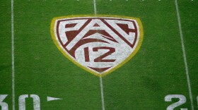 The PAC-12 logo at Sun Devil Stadium is displayed on the field during the second half of an NCAA college football game between Arizona State and Kent State in Tempe, Ariz., Aug. 29, 2019.