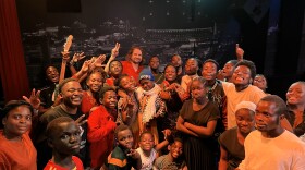 The Salvation Choir smile at the camera with Kansas City musician Kevin Morby. The choir covered his song, "This Is A Photograph" in 2023.