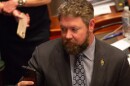 Rep. Harry Benton takes a picture during a joint session of the Illinois House in May 2026.
