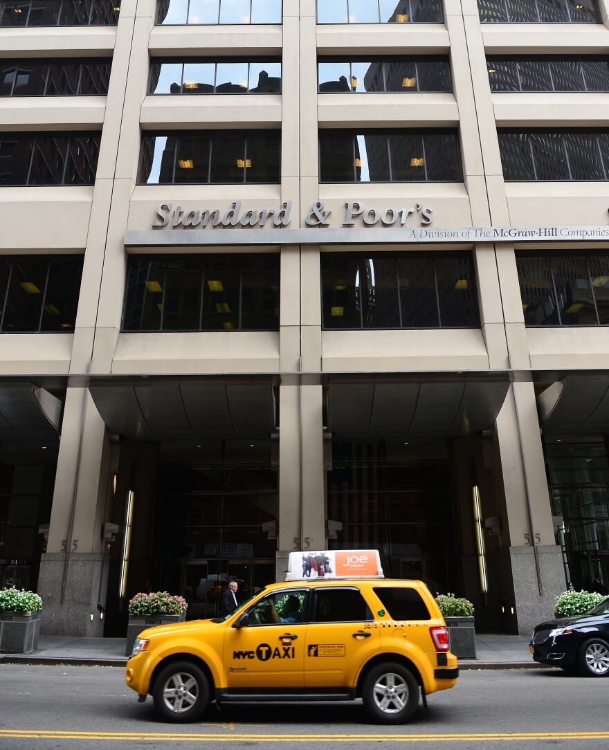 A sign for Standard & Poor's rating agency stands in front of the company headquarters in New York.