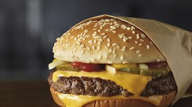 This image provided by McDonald’s Corporation shows a Quarter Pounder burger. McDonald's says it will swap frozen beef patties for fresh ones in its Quarter Pounder burgers by sometime in 2018 at most of its U.S. locations. (Courtesy of McDonald’s Corporation via AP)