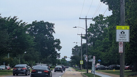 Signs in front of Granby High School warn motorists they may get a ticket if they're caught speeding by a camera. But only about half of speeders actually pay the fines.