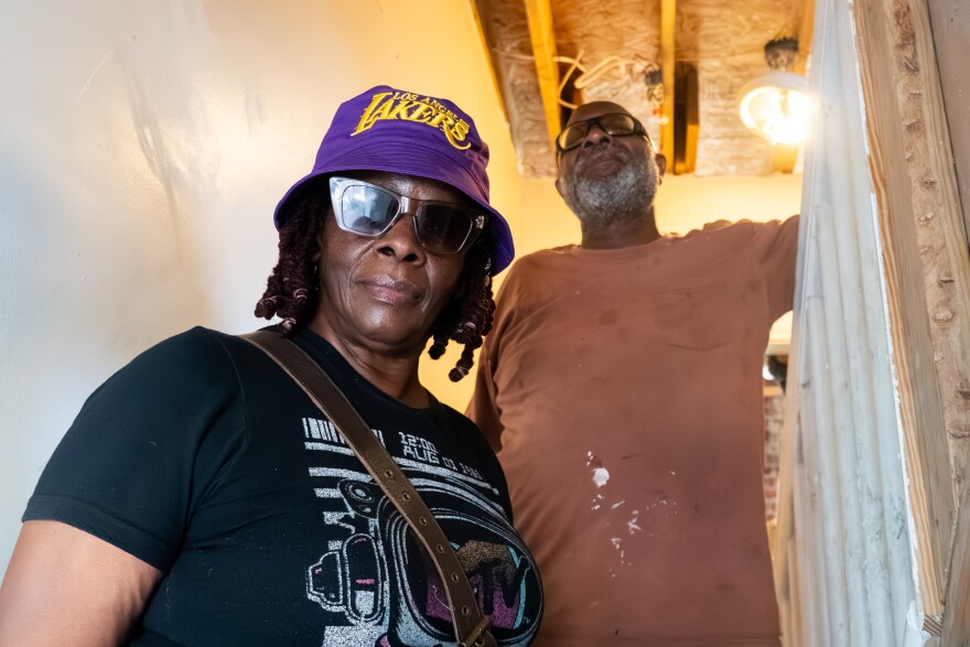 Emma and Rahtu Stroud in their tornado-damaged home on Wednesday, Sept. 10, 2025, in St. Louis’ Academy neighborhood. The high winds of May’s EF3 twister tore off a portion of the roof of their 120-year-old home, leaving a massive hole in its flat area and throwing the rest into the nearby yard.