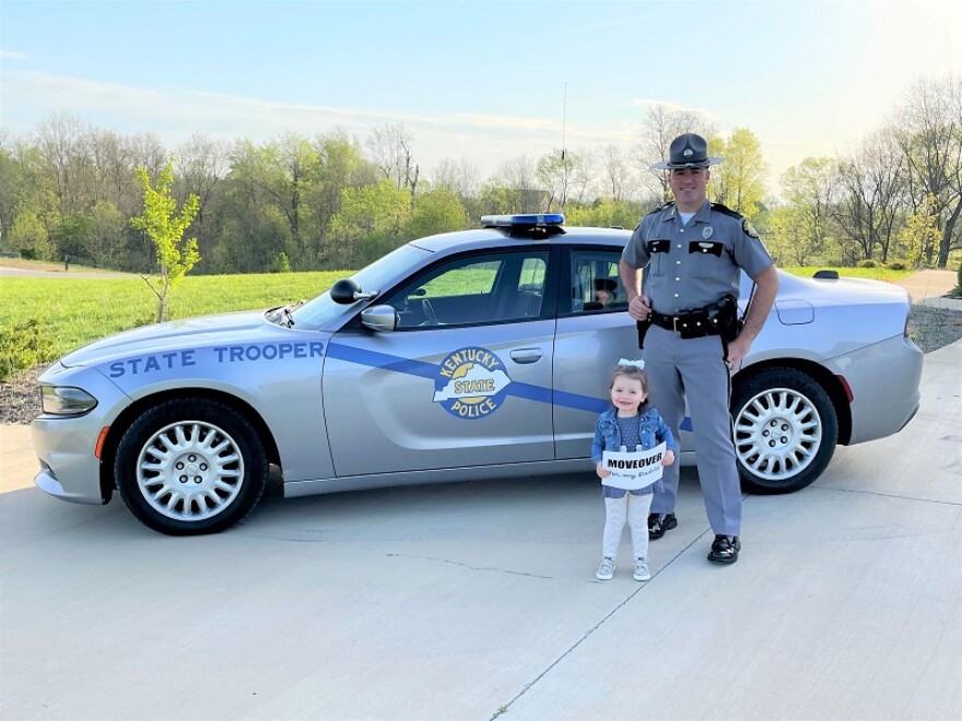 KSP Trooper Matt Sudduth, shown here with his daughter Emilyn, is an example of the first responders a new campaign called "Slow Down And Move Over" is designed to protect.
