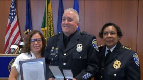 Officer Denny Wright receives the Medal of Valor and Purple Heart from RPD Interim Chief Cynthia Herriott-Sullivan on 8/5/21