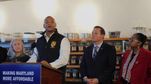 Gov. Wes Moore announces legislation to ban dynamic pricing alongside Senate President Bill Ferguson (right) and House Speaker Joseline Peña-Melnyk (far right) at BD Provisions in Severna Park, Md.