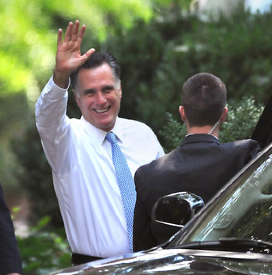 Republican Presidential candidate Mitt Romney waves as he leaves a fundraiser at the Duke Mansion in Charlotte on Wednesday,