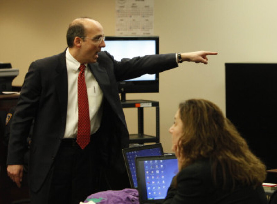 Prosecutor James Bargnesi pointing to McCray in courtroom