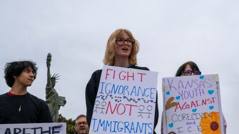 Darley Kasper, right, was one of dozens of protesters outside of city hall in Leavenworth, Kansas, who demonstrated against CoreCivic and the Trump administration's immigration policies.