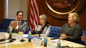 From left to right: New Mexico Lt. Gov. Howie Morales, Gov. Michelle Lujan Grisham and Early Childhood Education and Care Department Secretary Elizabeth Groginsky, pictured at a Sept. 8, 2025, news conference announcing the state’s universal childcare program. (Source NM file photo)
