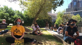 Several dozen people gathered outside the Sacramento County Board of Supervisors chambers to draw attention to homelessness, youth violence, housing insecurity and other issues.