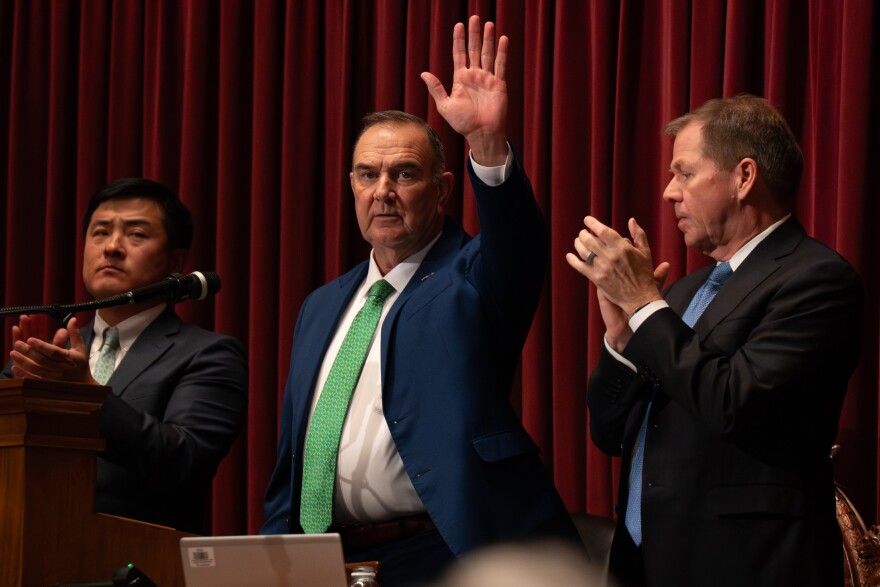 Missouri Gov. Mike Kehoe, center, waves after delivering the annual Missouri State of the State address while flanked by House Majority Leader Jon Patterson, R-Lee’s Summit, and Lt. Gov. David Wasinger, right, on Tuesday, Jan. 13, 2026, at the Capitol in Jefferson City.