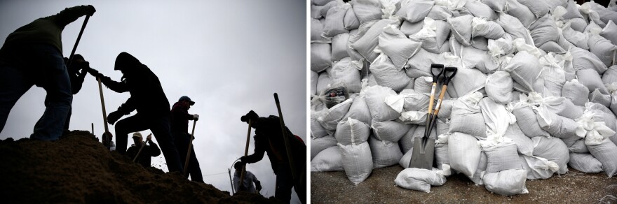 (At left) Volunteers use shovels atop a pile of sand as they help fill sandbags on Tuesday in St. Louis. (At right) Shovels lean against a sandbag wall on Monday in Kimmswick, Mo.