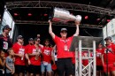 Carolina Hurricanes majority owner Tom Dundon holds the Stanley Cup in the air during the NHL hockey club's championship celebration in Raleigh, N.C., Saturday, June 20, 2026.