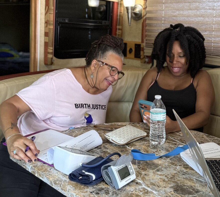 Midwife Sheila Simms Watson, left, talks with Isis Daaga during a pregnancy checkup at the Southern Birth Justice Network’s mobile midwifery clinic in Miami on March 21.