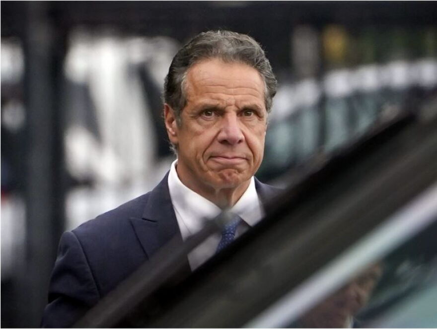 Former Gov. Andrew Cuomo, wearing a blue suit and tie.