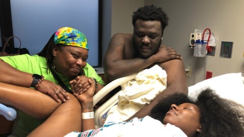 Nataki Hill (left) supports Alysia Hanbrick during labor at her bedside.