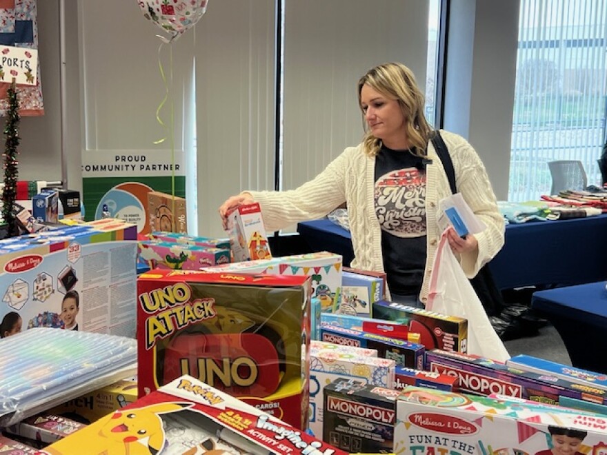 Kasey Bonner looks for toys for a foster child she works with.