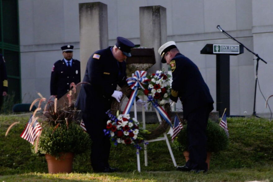 A wreath is placed in front of a steal beam from the World Trade Center, which was targeted in the attack, during Bloomington's Ivy Tech Community College's annual 9/11 ceremony on Sept. 11, 2025.