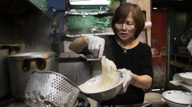 Minh Pham portions out noodles for customers on Tuesday, August 15, 2017, in the kitchen at Pho Bac on S. Jackson St., in Seattle. 