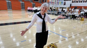  A woman poses on a basketball court before a Granny Basketball game.