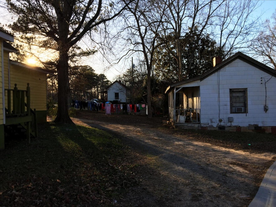 The sun sets on the Rose Hill neighborhood of Porterdale, Georgia. These homes were built in the early 20th century for African-American workers at the nearby cotton mill.
(Sam Whitehead/GPB)