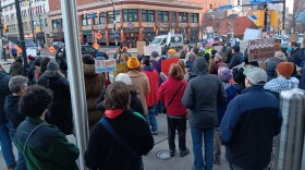 Protesters stand outside 250 Delaware Avenue in Buffalo Thursday, Jan. 8, 2026. Local ICE offices are located inside the building. The protest was organized in response to the fatal shooting of a woman by an ICE agent in Minneapolis Jan. 7.
